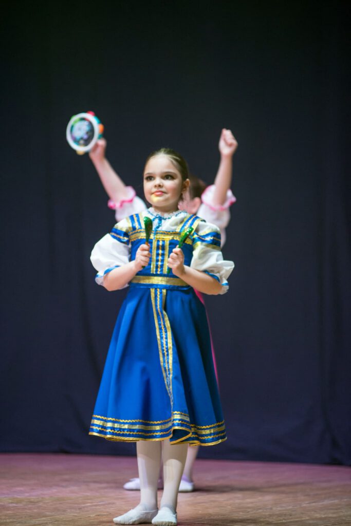 a young student performs at International Expo