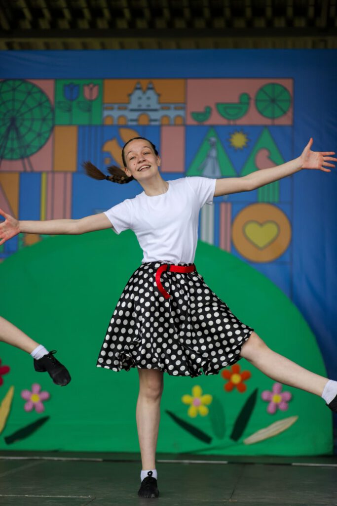 a student performs in a musical