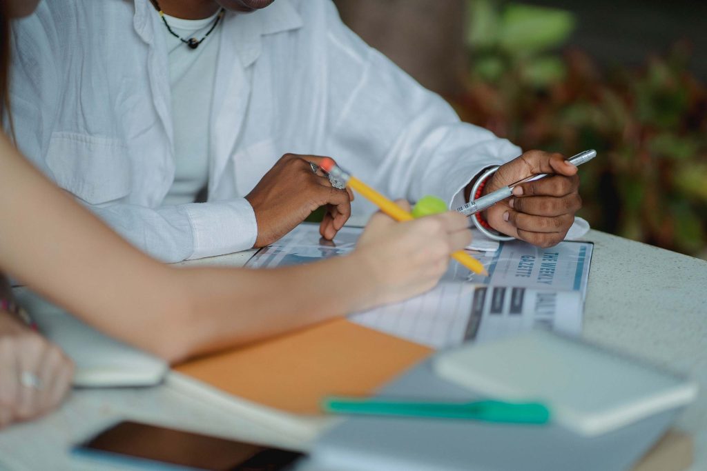 Two people working on an application document together.